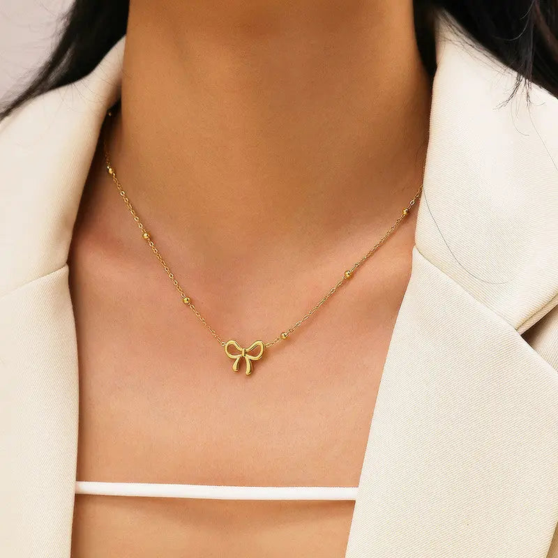 Anti Tarnish Infinity Bow Pendant Set Gold Plated Coruscate Jewels