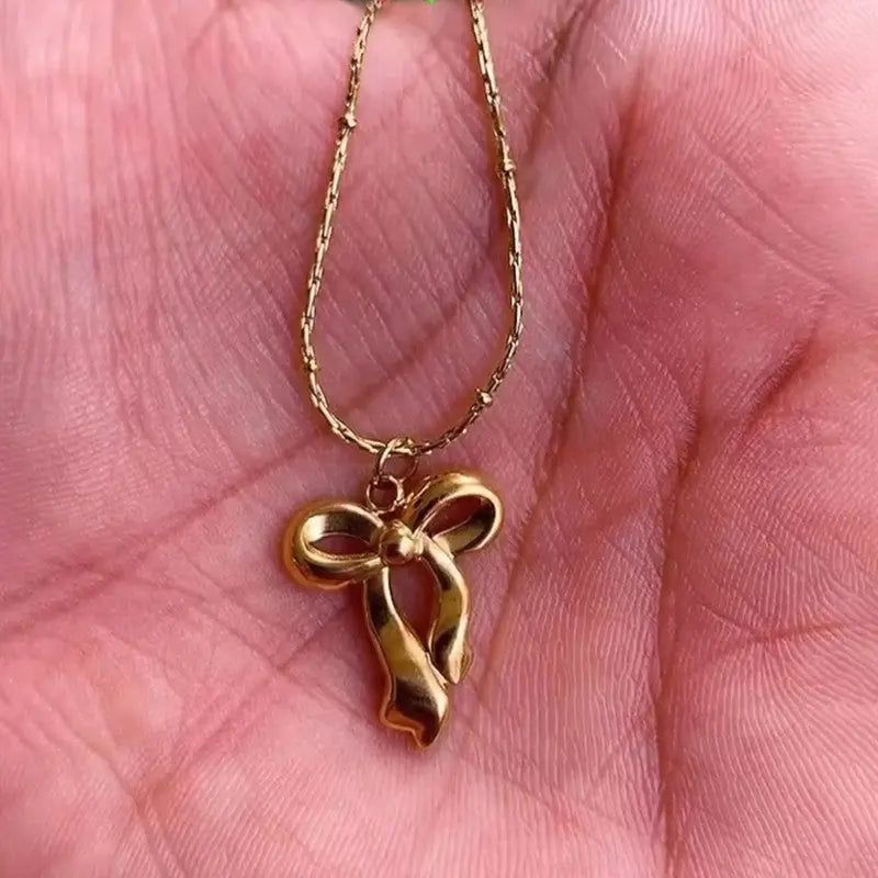 Anti Tarnish Gold Plated Infinity Bow Pendant Coruscate Jewels